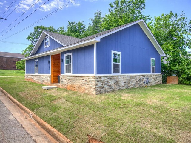 1800 NW 41st St, Oklahoma City, OK 73118 - view of front of property featuring a front lawn, brick siding, and stone siding