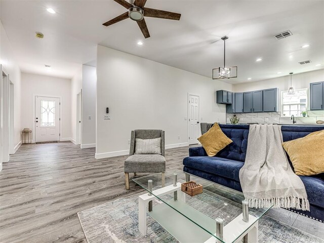 1800 NW 41st St, Oklahoma City, OK 73118 - living room featuring light wood-style floors, recessed lighting, ceiling fan, and baseboards