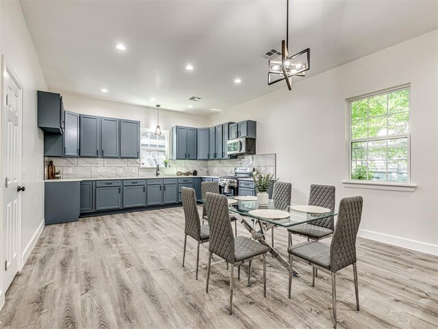1800 NW 41st St, Oklahoma City, OK 73118 - dining space featuring light wood-style floors, baseboards, a chandelier, and recessed lighting