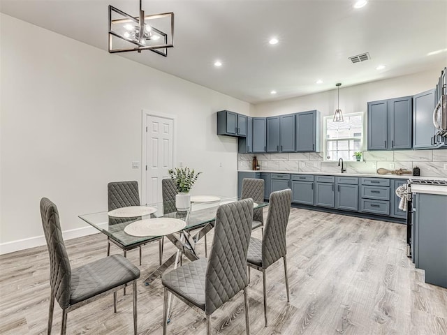 1800 NW 41st St, Oklahoma City, OK 73118 - dining space featuring a chandelier, light wood finished floors, recessed lighting, and baseboards