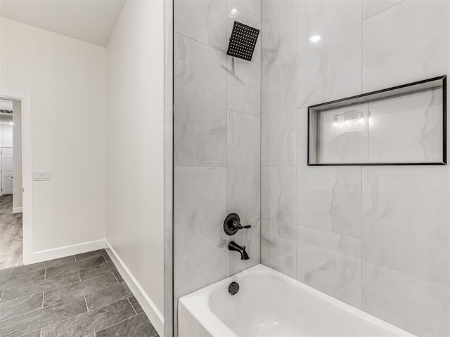 1800 NW 41st St, Oklahoma City, OK 73118 - bathroom with bathing tub / shower combination and baseboards