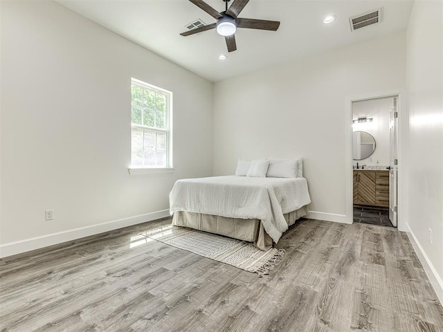 1800 NW 41st St, Oklahoma City, OK 73118 - bedroom featuring wood finished floors, baseboards, ensuite bathroom, recessed lighting, and ceiling fan