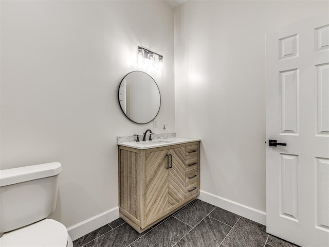 1800 NW 41st St, Oklahoma City, OK 73118 - bathroom featuring baseboards, toilet, and vanity