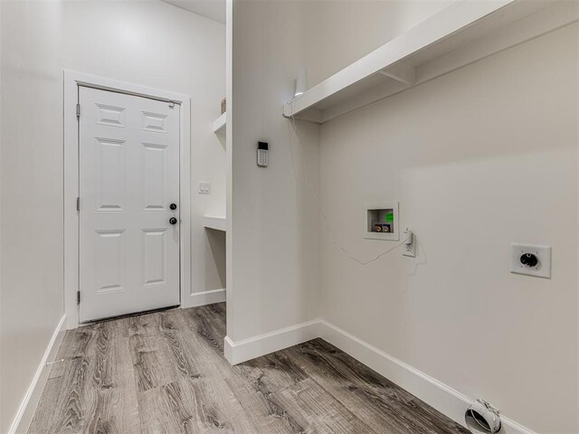 1800 NW 41st St, Oklahoma City, OK 73118 - clothes washing area featuring hookup for a washing machine, wood finished floors, electric dryer hookup, and baseboards