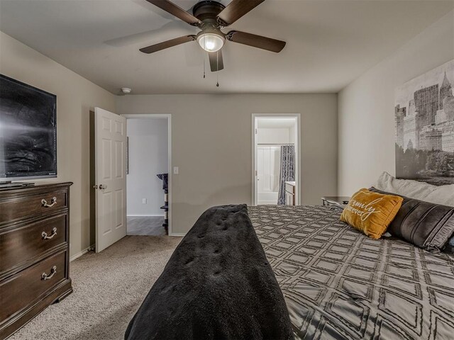 424 SE 5th Ter, Newcastle, OK 73065 - carpeted bedroom featuring ensuite bathroom, a ceiling fan, and baseboards