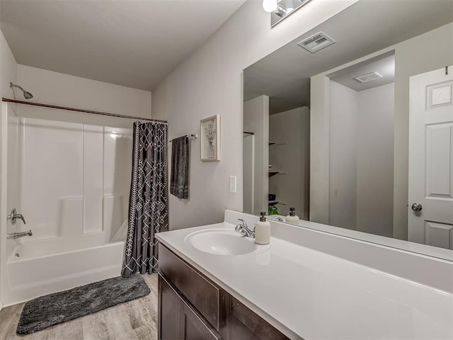 424 SE 5th Ter, Newcastle, OK 73065 - full bath with wood finished floors, shower / bath combo with shower curtain, and vanity