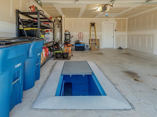 424 SE 5th Ter, Newcastle, OK 73065 - garage with gas water heater and a garage door opener