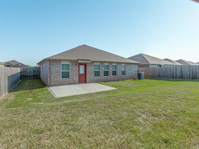 424 SE 5th Ter, Newcastle, OK 73065 - back of house featuring a patio area, central AC, and brick siding