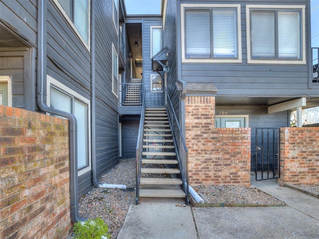 11530 N May Ave Unit D303, Oklahoma City, OK 73120 - view of exterior entry featuring a gate and brick siding
