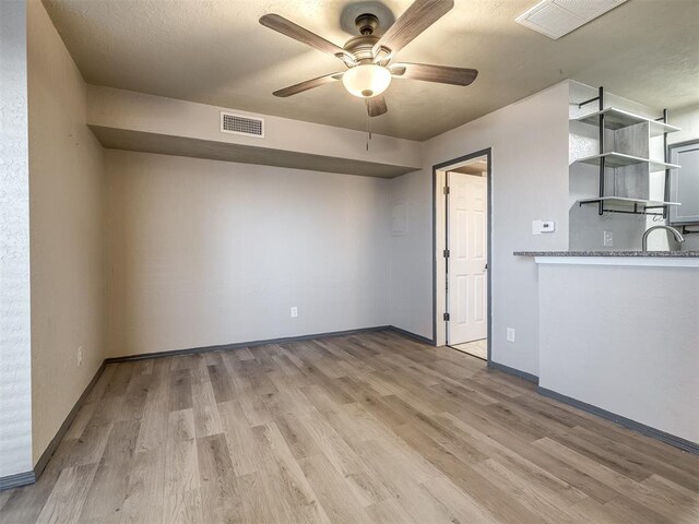11530 N May Ave Unit D303, Oklahoma City, OK 73120 - spare room with a ceiling fan and light wood-style floors
