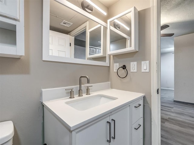 11530 N May Ave Unit D303, Oklahoma City, OK 73120 - bathroom featuring vanity and wood finished floors