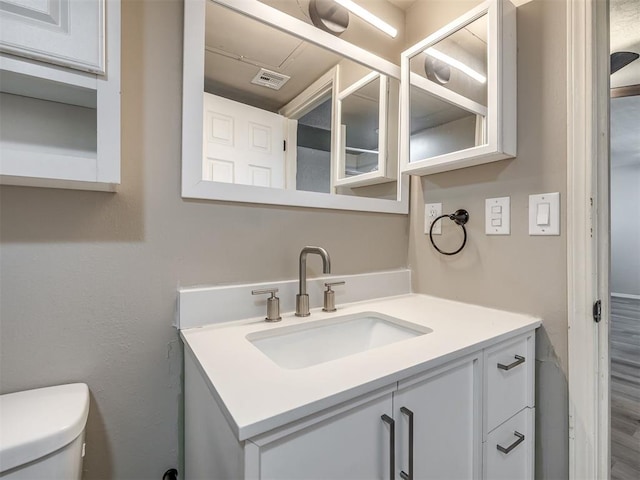 11530 N May Ave Unit D303, Oklahoma City, OK 73120 - bathroom featuring vanity and wood finished floors