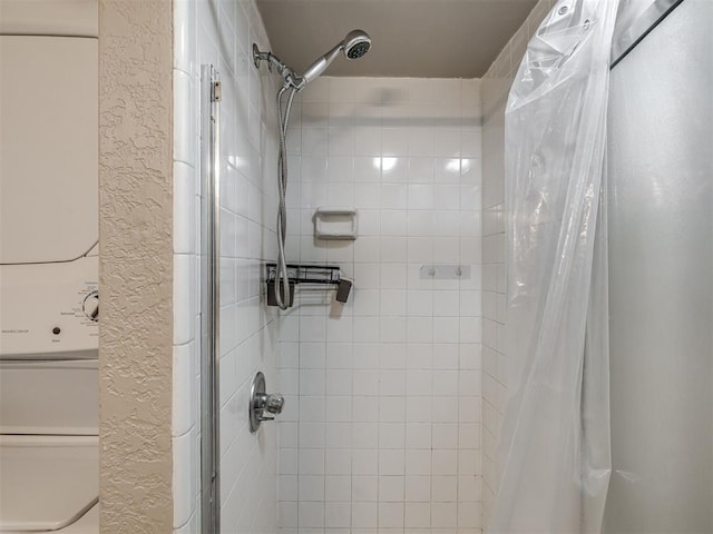 11530 N May Ave Unit D303, Oklahoma City, OK 73120 - full bathroom with a tile shower and a textured wall