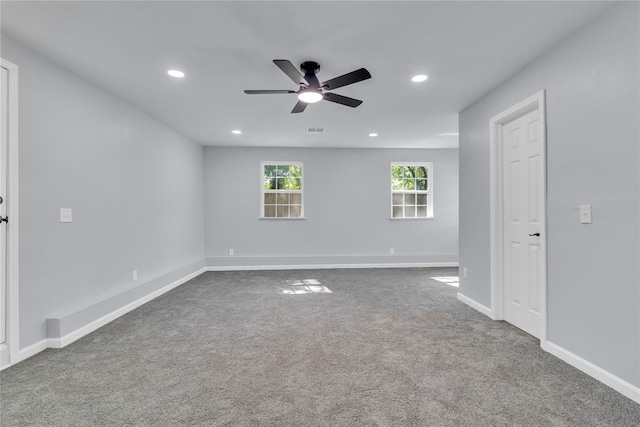 empty room featuring ceiling fan, recessed lighting, carpet floors, and baseboards
