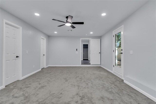 carpeted spare room featuring ceiling fan, recessed lighting, and baseboards