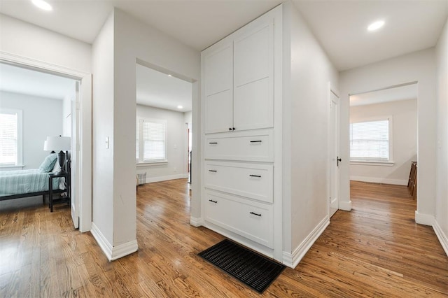 2237 NW 30th St, Oklahoma City, OK 73112 - corridor with light wood-type flooring, healthy amount of natural light, baseboards, and recessed lighting