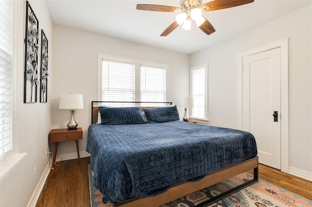 2237 NW 30th St, Oklahoma City, OK 73112 - bedroom with wood finished floors, baseboards, and a ceiling fan
