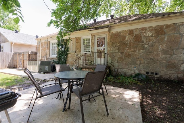 2237 NW 30th St, Oklahoma City, OK 73112 - view of patio featuring outdoor dining area and fence