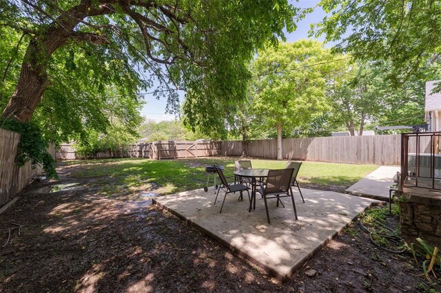 2237 NW 30th St, Oklahoma City, OK 73112 - view of yard with a patio and outdoor dining space