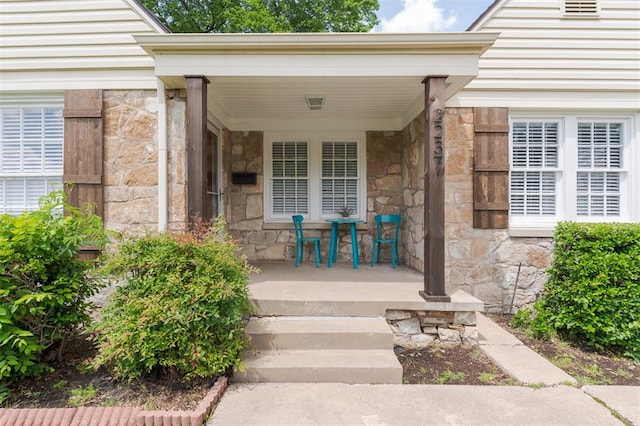 2237 NW 30th St, Oklahoma City, OK 73112 - property entrance featuring stone siding and a porch