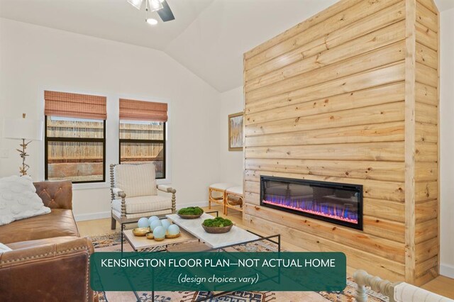 24119 Western Ave, Washington, OK 73093 - living room featuring vaulted ceiling, a glass covered fireplace, a ceiling fan, wood finished floors, and baseboards