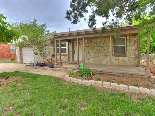 1829 Westchester Dr, Oklahoma City, OK 73120 - ranch-style home with stone siding, covered porch, driveway, and an attached garage