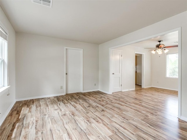 1829 Westchester Dr, Oklahoma City, OK 73120 - spare room with light wood-type flooring, ceiling fan, and baseboards