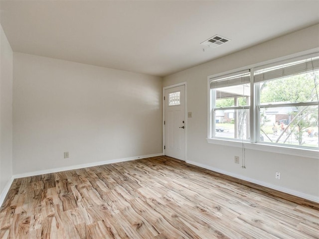 1829 Westchester Dr, Oklahoma City, OK 73120 - foyer entrance with light wood finished floors, healthy amount of natural light, and baseboards