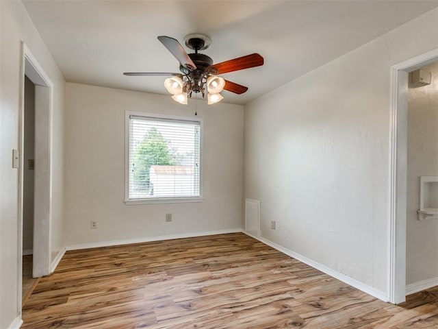1829 Westchester Dr, Oklahoma City, OK 73120 - unfurnished room featuring wood finished floors, a ceiling fan, and baseboards
