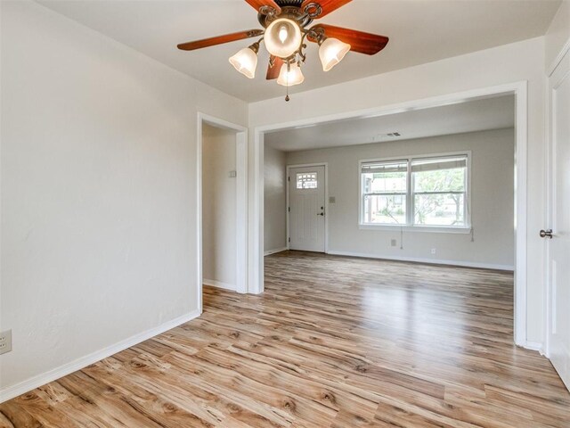 1829 Westchester Dr, Oklahoma City, OK 73120 - empty room with light wood-style floors, a ceiling fan, and baseboards