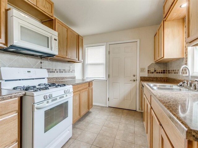 1829 Westchester Dr, Oklahoma City, OK 73120 - kitchen featuring white appliances, a sink, healthy amount of natural light, and light brown cabinets