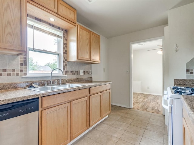 1829 Westchester Dr, Oklahoma City, OK 73120 - kitchen with dishwasher, a sink, white gas range oven, and light brown cabinetry