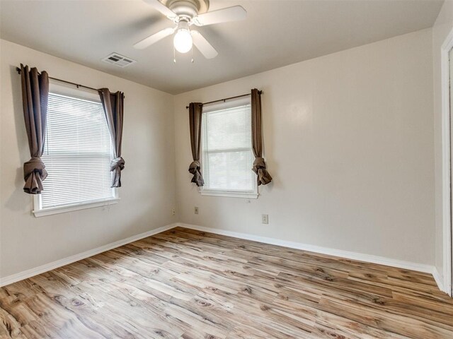 1829 Westchester Dr, Oklahoma City, OK 73120 - spare room with wood finished floors, plenty of natural light, and baseboards