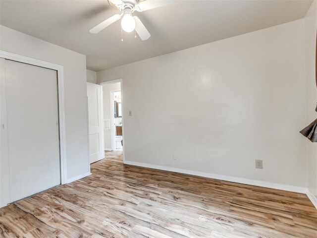 1829 Westchester Dr, Oklahoma City, OK 73120 - unfurnished bedroom with wood finished floors, a closet, baseboards, and ceiling fan
