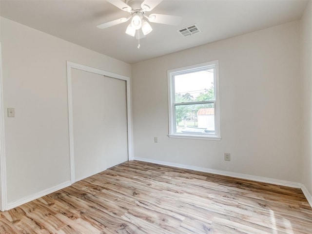 1829 Westchester Dr, Oklahoma City, OK 73120 - unfurnished bedroom with wood finished floors, a closet, baseboards, and ceiling fan