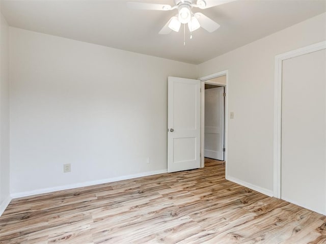 1829 Westchester Dr, Oklahoma City, OK 73120 - unfurnished bedroom with wood finished floors, baseboards, and ceiling fan