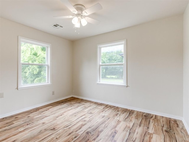 1829 Westchester Dr, Oklahoma City, OK 73120 - empty room featuring plenty of natural light, light wood-style flooring, and baseboards