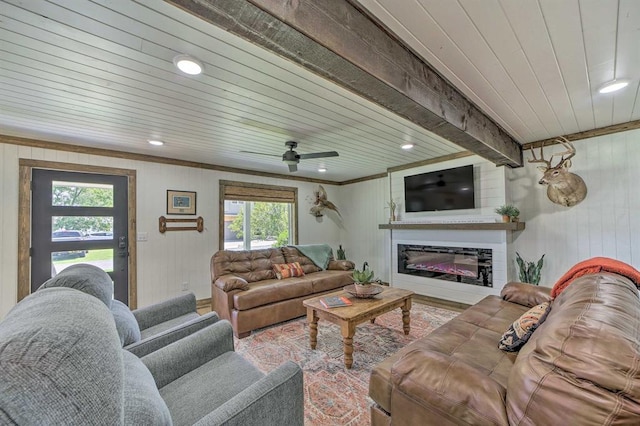 519 N J St, Eufaula, OK 74432 - living area with plenty of natural light, wood ceiling, a glass covered fireplace, wooden walls, and recessed lighting