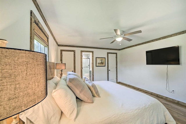 519 N J St, Eufaula, OK 74432 - bedroom with ornamental molding, wood finished floors, connected bathroom, ceiling fan, and baseboards