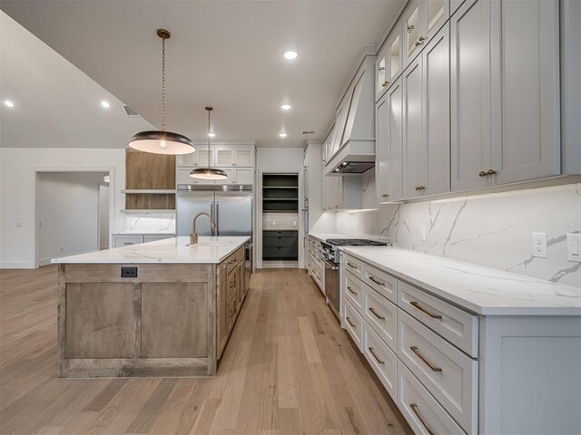 6201 Canopy Ln, Edmond, OK 73025 - kitchen with premium appliances, light wood-type flooring, backsplash, open shelves, and premium range hood