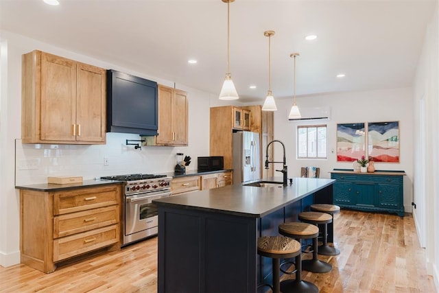 221 Alameda St, Norman, OK 73069 - kitchen with high end range, a sink, dark countertops, extractor fan, and recessed lighting