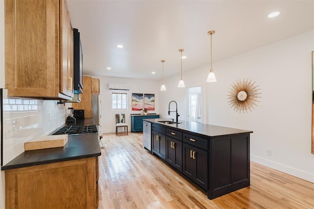 221 Alameda St, Norman, OK 73069 - kitchen with a sink, dark countertops, light wood-style floors, dishwasher, and recessed lighting