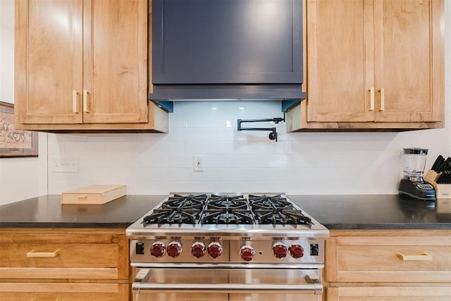 221 Alameda St, Norman, OK 73069 - kitchen with high end stainless steel range oven, dark countertops, and decorative backsplash