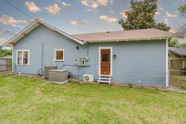 221 Alameda St, Norman, OK 73069 - back of house featuring central air condition unit, entry steps, and a cooling unit