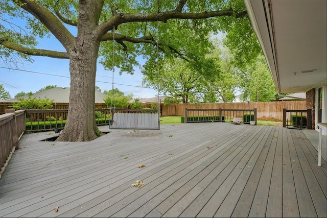 3222 Wilshire Ter, Oklahoma City, OK 73116 - wooden terrace with a fenced backyard