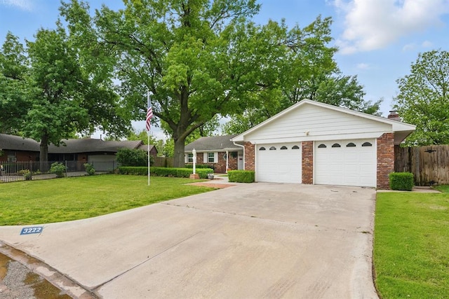 3222 Wilshire Ter, Oklahoma City, OK 73116 - ranch-style home with driveway, brick siding, and an attached garage