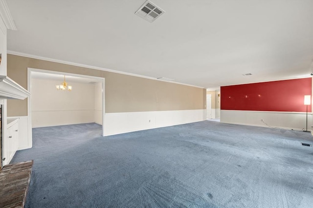 3222 Wilshire Ter, Oklahoma City, OK 73116 - unfurnished living room with carpet floors, a chandelier, crown molding, and wainscoting