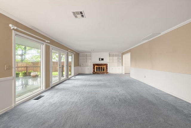 3222 Wilshire Ter, Oklahoma City, OK 73116 - unfurnished living room with french doors, light colored carpet, a fireplace, ornamental molding, and baseboards