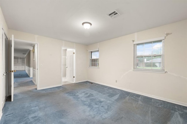 3222 Wilshire Ter, Oklahoma City, OK 73116 - unfurnished bedroom featuring dark carpet and baseboards