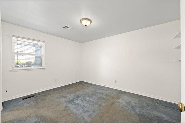 3222 Wilshire Ter, Oklahoma City, OK 73116 - empty room featuring dark colored carpet and baseboards